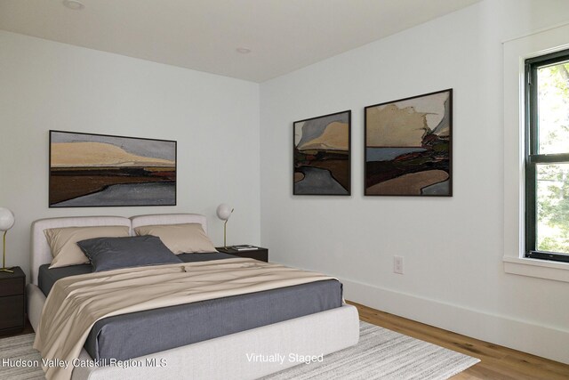 bedroom featuring hardwood / wood-style flooring