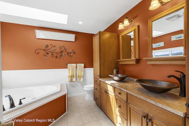 19 Pompeys Cave Rd, High Falls, NY 12440 - full bath with a skylight, double vanity, toilet, a bath, and tile patterned floors