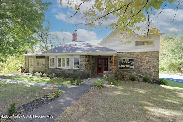 651 Glasco Tpke, Saugerties, NY 12477 - view of front facade featuring a chimney, stone siding, and a front lawn