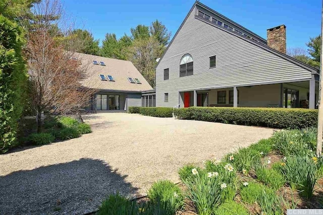 126 Shaker Ridge Dr, Canaan, NY 12029 - rear view of house featuring a chimney
