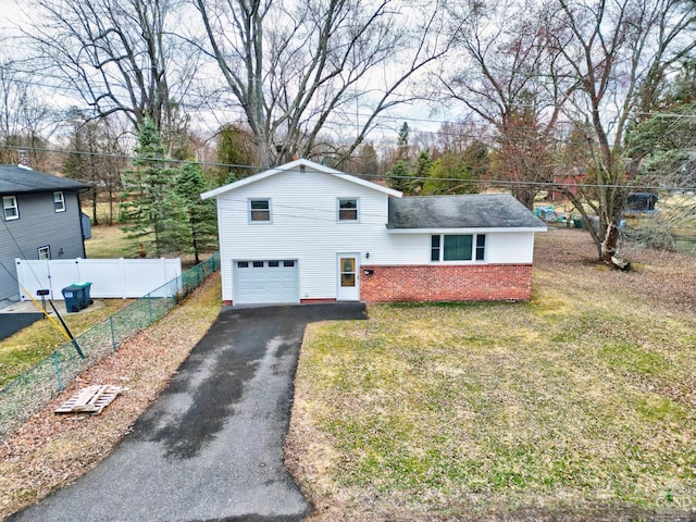 17 Bogardus Ave, Catskill, NY 12414 - view of front facade with brick siding, an attached garage, driveway, and roof with shingles