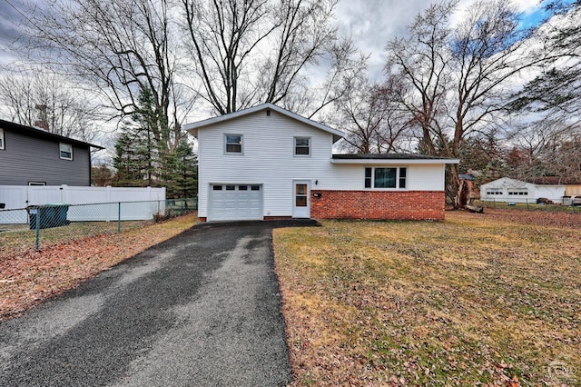 17 Bogardus Ave, Catskill, NY 12414 - view of front of property featuring an attached garage, brick siding, and asphalt driveway