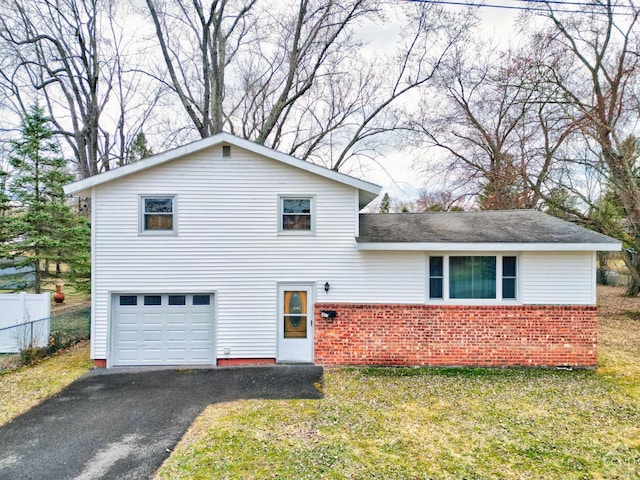 17 Bogardus Ave, Catskill, NY 12414 - view of front of house featuring brick siding, an attached garage, asphalt driveway, and a shingled roof
