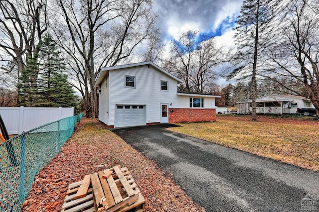 17 Bogardus Ave, Catskill, NY 12414 - view of side of home with an attached garage and asphalt driveway
