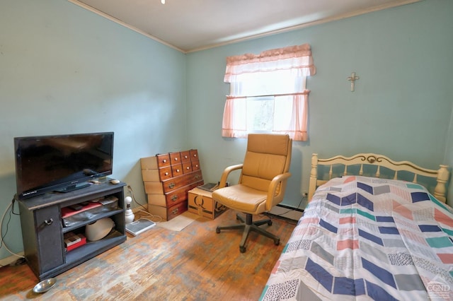 17 Bogardus Ave, Catskill, NY 12414 - bedroom featuring wood finished floors, ornamental molding, and a baseboard heating unit