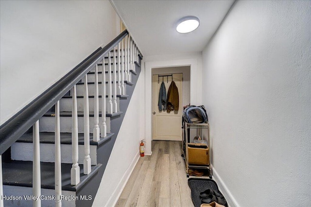 interior space featuring baseboards and wood finished floors