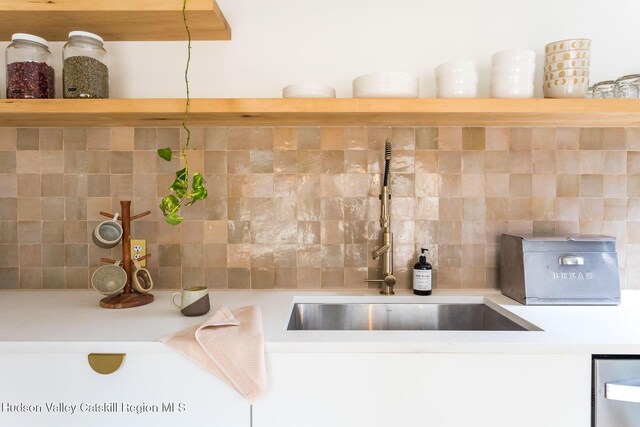 1637 Glasco Tpke, Woodstock, NY 12498 - details with light countertops, open shelves, decorative backsplash, and a sink