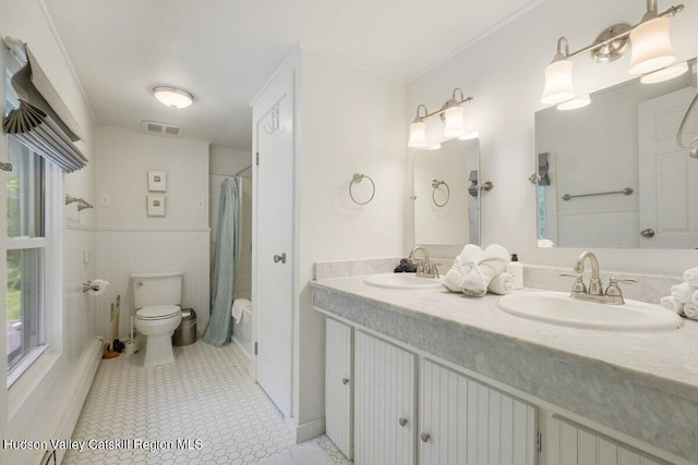 bathroom featuring toilet, vanity, tile patterned floors, and a shower with shower curtain