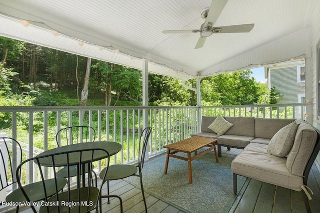 exterior space featuring ceiling fan and an outdoor hangout area