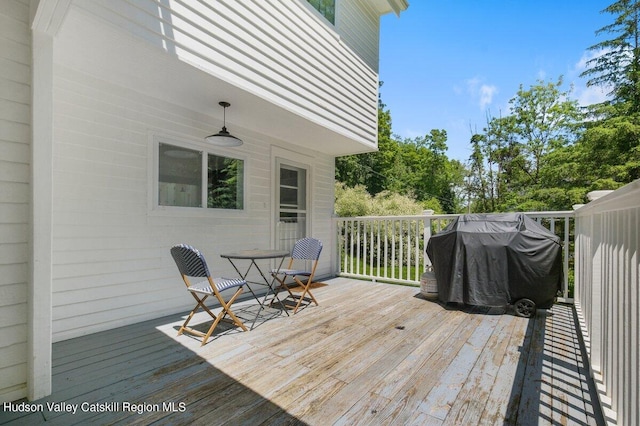 wooden deck featuring grilling area