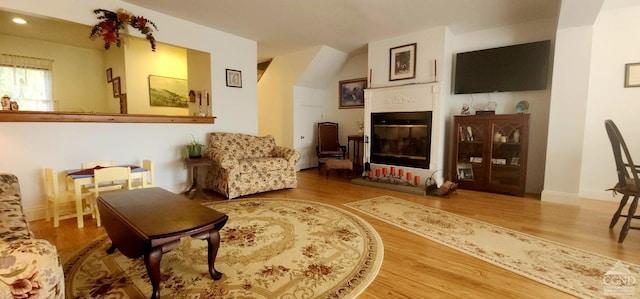 69 Windham Ridge Rd Unit 16F, Windham, NY 12496 - sitting room featuring wood finished floors, a glass covered fireplace, baseboards, and recessed lighting