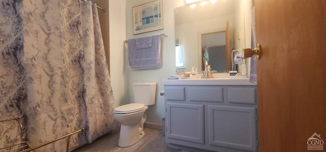 69 Windham Ridge Rd Unit 16F, Windham, NY 12496 - full bath featuring toilet, vanity, wood finished floors, and a shower with curtain