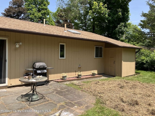 44 Overlook Dr, Woodstock, NY 12498 - rear view of house featuring a patio area and roof with shingles