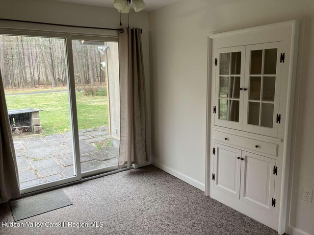 44 Overlook Dr, Woodstock, NY 12498 - unfurnished dining area with plenty of natural light and carpet floors