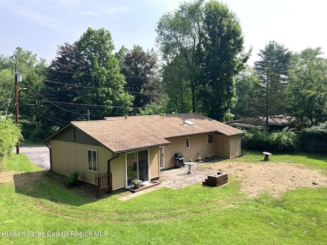 44 Overlook Dr, Woodstock, NY 12498 - back of house with roof with shingles, a patio, and a yard