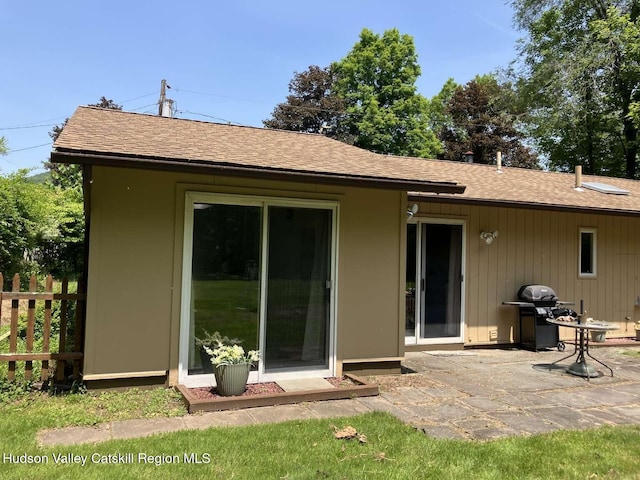 44 Overlook Dr, Woodstock, NY 12498 - rear view of house featuring a shingled roof and a patio