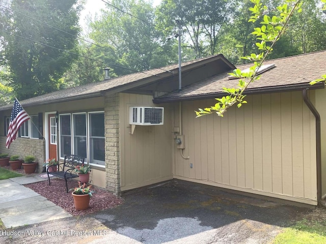 44 Overlook Dr, Woodstock, NY 12498 - view of side of property with a shingled roof and a wall mounted air conditioner