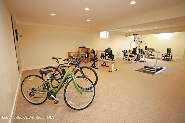 exercise room featuring baseboards, ornamental molding, and recessed lighting