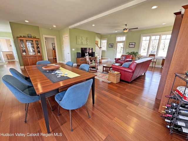 dining area with stairs, baseboards, wood finished floors, and recessed lighting