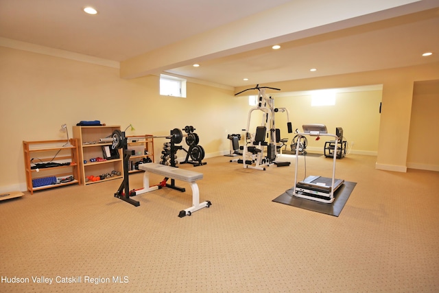 exercise room featuring baseboards, crown molding, and recessed lighting