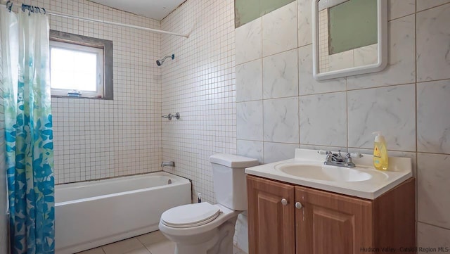 full bathroom with toilet, shower / bathtub combination with curtain, tile walls, and vanity