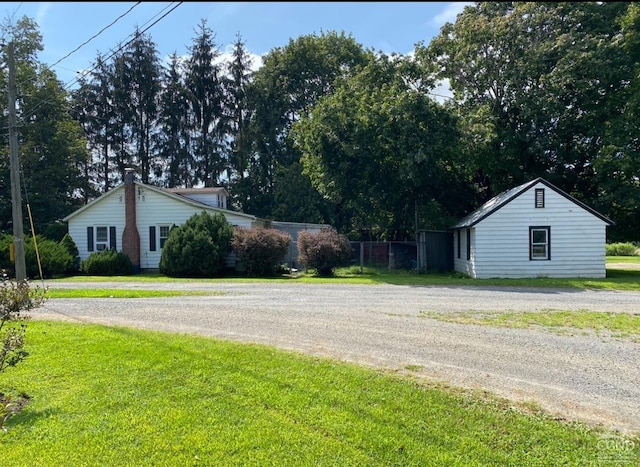 view of side of property with curved driveway