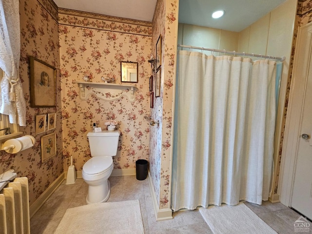 bathroom with radiator, tile patterned flooring, toilet, a shower with shower curtain, and baseboards