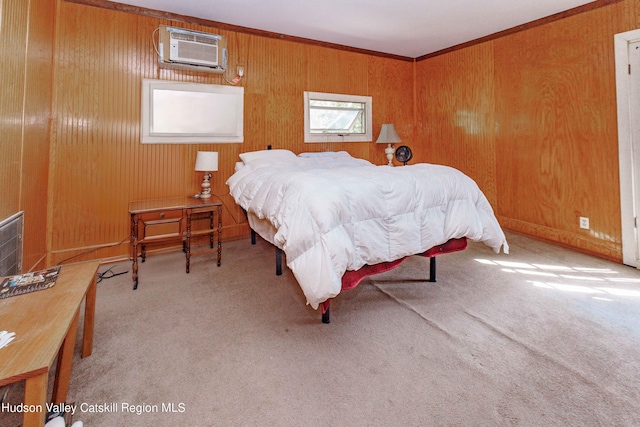 bedroom with light carpet, a wall unit AC, and crown molding