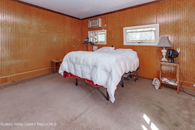 bedroom with carpet flooring, ornamental molding, wooden walls, and a wall mounted AC