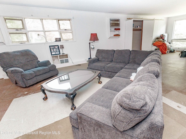 living room featuring a wall unit AC