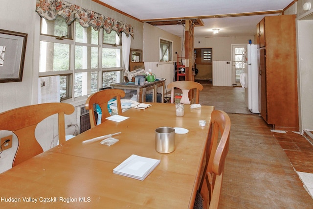 dining room featuring decorative columns and ornamental molding