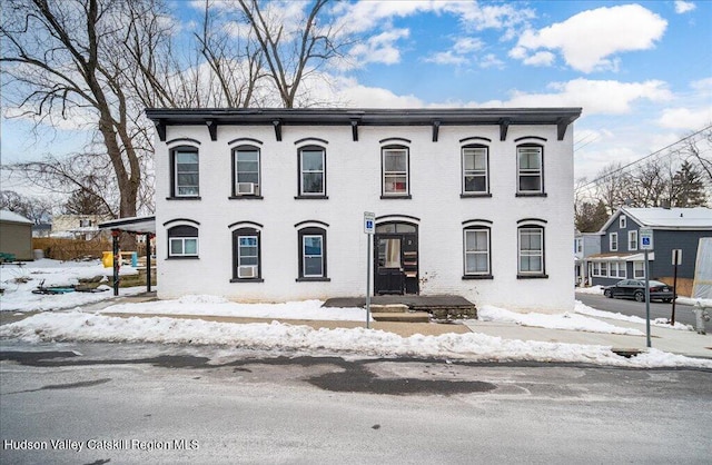 view of front of property featuring brick siding