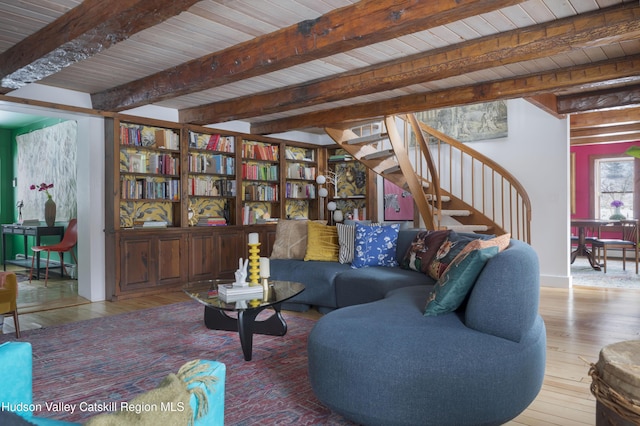 living room with beamed ceiling, hardwood / wood-style floors, and wooden ceiling