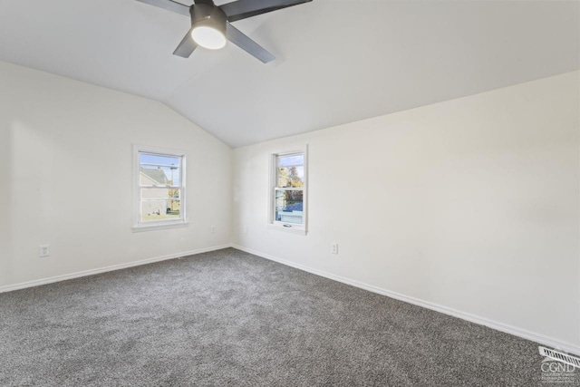 124 Cottage St, Ravena, NY 12143 - spare room featuring lofted ceiling, dark colored carpet, healthy amount of natural light, baseboards, and ceiling fan