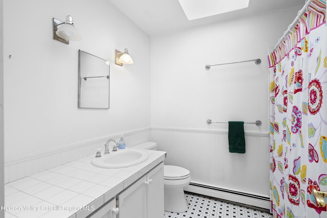 293 Pine Bush Rd, Stone Ridge, NY 12484 - bathroom featuring wainscoting, vanity, a baseboard radiator, a skylight, and a shower with curtain