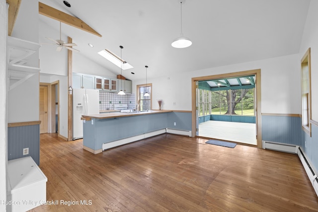 293 Pine Bush Rd, Stone Ridge, NY 12484 - unfurnished living room featuring wood finished floors, high vaulted ceiling, healthy amount of natural light, beam ceiling, and a ceiling fan