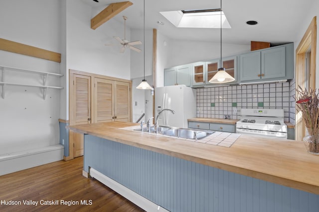 293 Pine Bush Rd, Stone Ridge, NY 12484 - kitchen featuring wood counters, a skylight, tasteful backsplash, white appliances, and pendant lighting