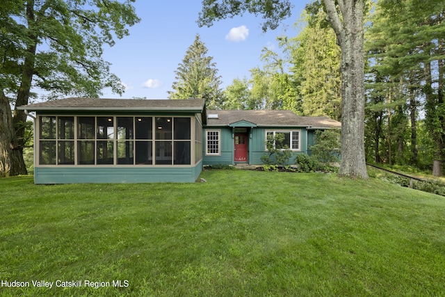 293 Pine Bush Rd, Stone Ridge, NY 12484 - view of front of home featuring a sunroom, a front lawn, and roof with shingles