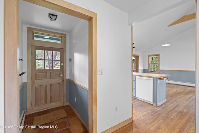 293 Pine Bush Rd, Stone Ridge, NY 12484 - entryway with wainscoting, baseboard heating, vaulted ceiling, and a baseboard radiator