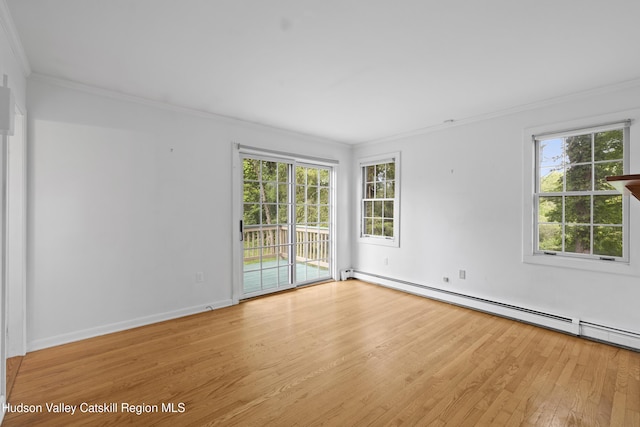 293 Pine Bush Rd, Stone Ridge, NY 12484 - empty room featuring ornamental molding, light wood-style flooring, baseboard heating, and plenty of natural light
