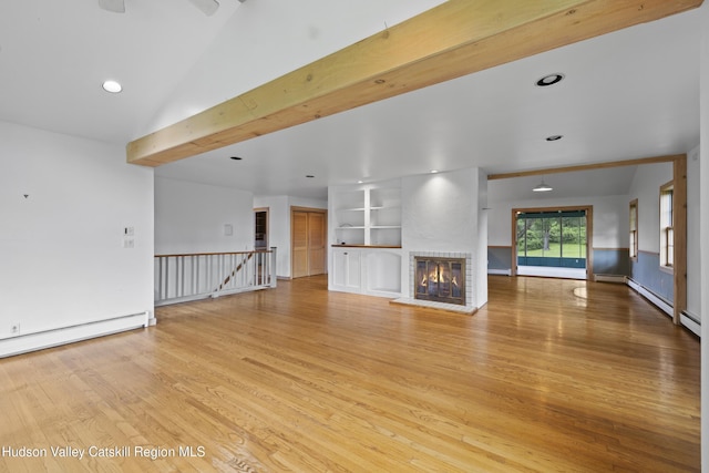 293 Pine Bush Rd, Stone Ridge, NY 12484 - unfurnished living room with light wood finished floors, a fireplace, recessed lighting, and a baseboard heating unit