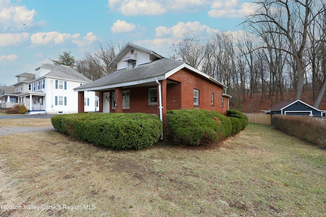 view of property exterior with a lawn