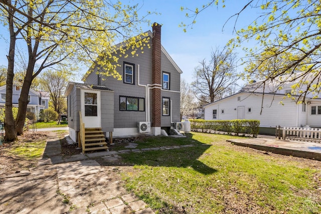 4 Lawrence Ave, Coxsackie, NY 12051 - back of property featuring entry steps, a chimney, a yard, and a cooling unit