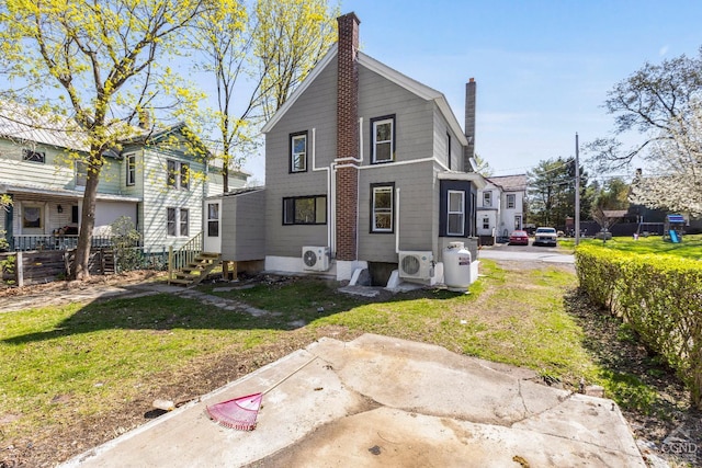 4 Lawrence Ave, Coxsackie, NY 12051 - back of house with a chimney, entry steps, and ac unit