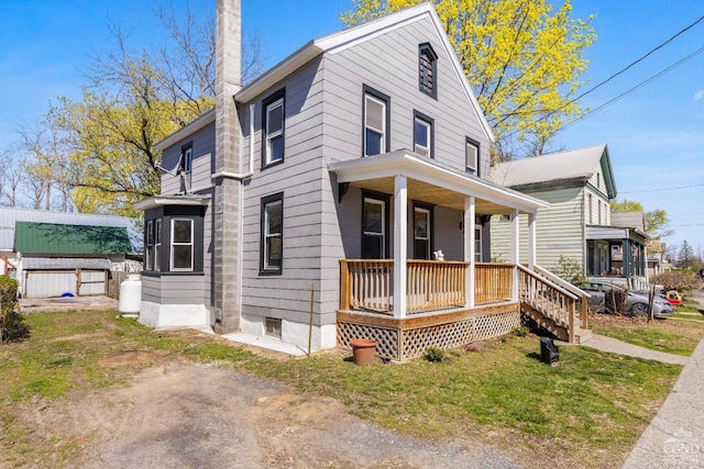 4 Lawrence Ave, Coxsackie, NY 12051 - view of front of home featuring covered porch and a chimney