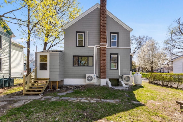 4 Lawrence Ave, Coxsackie, NY 12051 - rear view of house featuring a chimney, a cooling unit, and entry steps