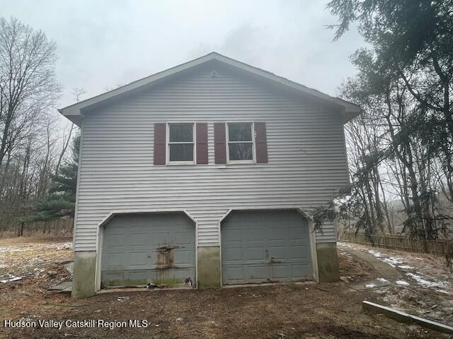 view of property exterior with a garage