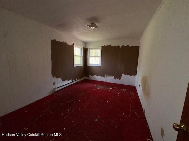 spare room with a baseboard radiator