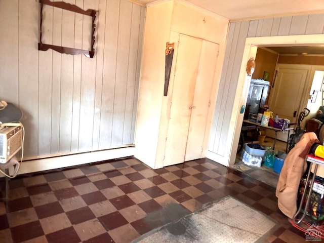 417 State St, Hudson, NY 12534 - foyer with dark floors, wooden walls, and ornamental molding