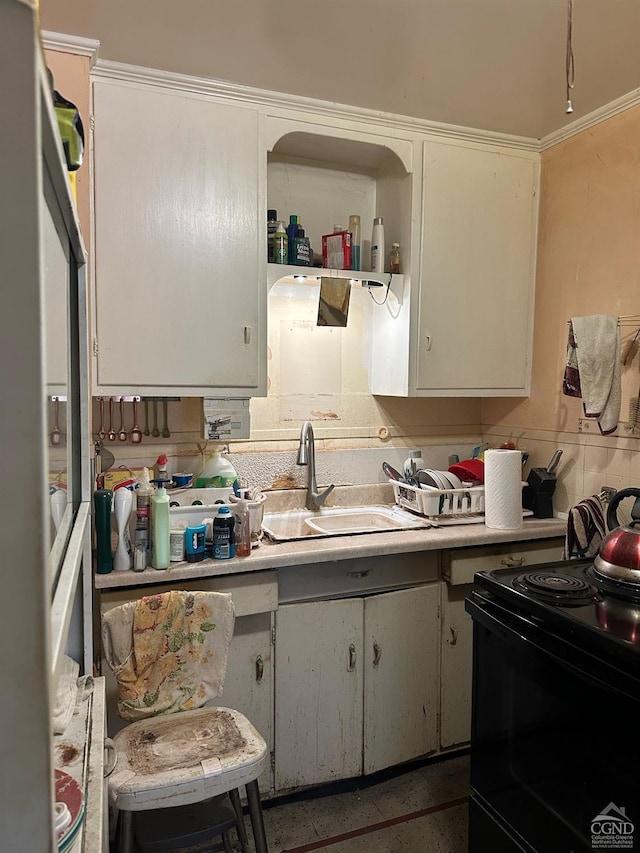 417 State St, Hudson, NY 12534 - kitchen with black range with electric cooktop, a sink, light countertops, white cabinetry, and open shelves